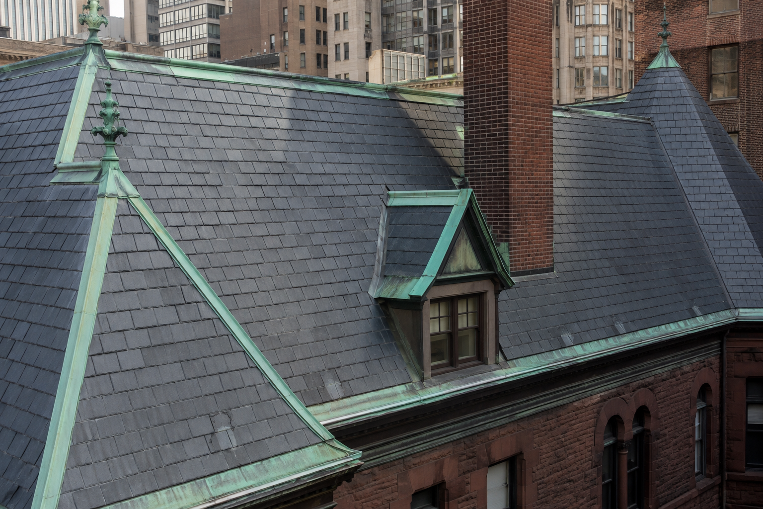 Genuine Vermont slate roof installation on NYC historic brownstone by Nexus Construction Group Inc